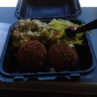Combo plate:  crab cakes: huge & tasty. 2 sides: mac & cheese and coconut curry cabbage. all amazing!!!  at The Land of Kush in Baltimore