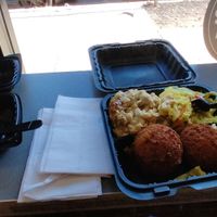 Amazing giant crab cakes and just as amazing side dishes! He also gave me some of the blueberry pancakes: probably the best pancakes I've ever had! at The Land of Kush in Baltimore