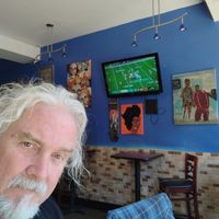 cool art on walls, and even a tv! at The Land of Kush in Baltimore