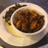 Collard greens and meat  at The Land of Kush in Baltimore