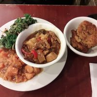 ribs in a sweet&sour-type sauce; kale salad that was a lil bit too pungent for me; candied sweet potatoes; "fish cakes" on the side  at The Land of Kush in Baltimore