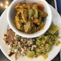 Coconut Chicken Curry with Curry Cabbage and Mac and Cheese at The Land of Kush in Baltimore