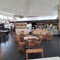 Seating and food stand at Markthalle in Basel