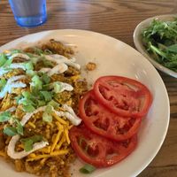 Potato Leek Omlette (tofu, vegan cheese & sour cream) with side of tomatoes & greens at Bouldin Creek Cafe in Austin