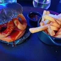 Black BBQ burger and fries at Guakame Street Food in Valencia
