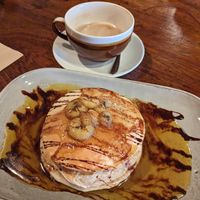 Caramelised banana pancakes and oat latte. at Scoff's Coffee House in Coleford