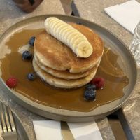 Vegan triple stacked pancakes with blueberries and banana  at Locals Coffee in Amsterdam