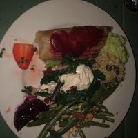 Ate outside and forgot to take pic first. Pickled mint 🍓, tamale, kale and cashew cheese salad, green beans, beats, quinoa dish, all very tasty and filling!! at Casa de Luz in Austin