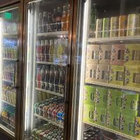 Drink coolers lined with fun sodas, cocktails, kombuchas, and more   at Eola General in Orlando