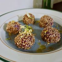 purple sweet potato and sesame dumplings with a miso, soy milk, and butterfly pea flower broth  at Venn Canteen in Porto