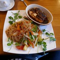 Silken tofu in black bean sauce. Very tangy. With noodles and salad. at Pumpernickel Coffee Shop in Dumfries