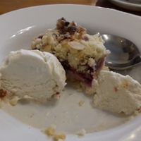 Vegan fruit crumble tart with vegan ice cream at Pumpernickel Coffee Shop in Dumfries