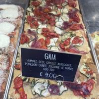 Pizza with hummus, tomato, zucchini and onions at La Cranceria in Florence