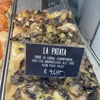 Pizza with potatoes and mushrooms and garlic olive oil at La Cranceria in Florence