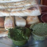 Breadsticks with cilantro pesto and basil cashew sauces at Sizzle Pie - E Burnside in Portland