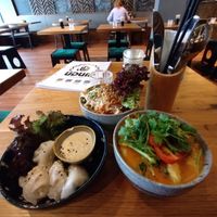 Coconut soup, steamed dumplings and coconut salad♥️ beautiful and delicious  at Udum in Cologne