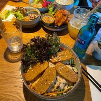 Vegan bowl with tempeh and brown rice and many vegan tapas  at Udum in Cologne