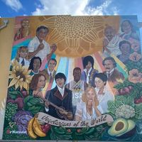 Vegetarians of the World mural outside the restaurant at Mr. Natural - East Cesar in Austin