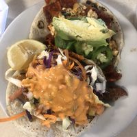 Vegan tacos - chilaquiles and seitan fish taco at Mr. Natural - East Cesar in Austin