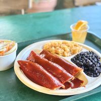Spinach and mushroom enchilada, beans and rice and a salad with homemade ranch dressing and a wellness shot  at Mr. Natural - East Cesar in Austin
