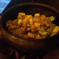 Guac with grilled pineapple pieces at Luvina Vegan Bar in Mexico City