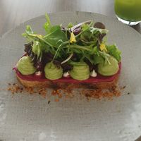 Avo with beetroot humous on sourdough at Thalatheen  in Doha