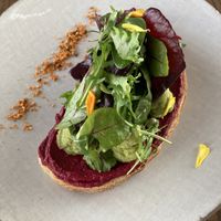 Avocado on sourdough  at Thalatheen  in Doha