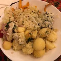 Salad from the buffet - sorry for crappy lighting. Tasted fantastic! Massaged cabbage, spiced carrots  and cucumber with black sesame, and potatoes. at Zloty Osiol in Katowice