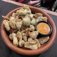 Carxofes arrebossades amb salsa romesco (demanar sense pernil)  at Granja el Melindro in Cardedeu