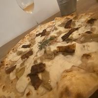 Great vegan pizza with selfmade ingrediens like Tasty vegan cheese and vegan bacon at A GoGò Pizzabar in Mallorca