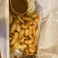 Scampi, chips, curry sauce, tartare sauce at Sea & Earth in Nottingham