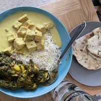 Coconut tofu, garlic rice, roti and sag aloo  at Gurkha in Dawlish