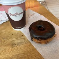 Oat milk latte and chocolate donut   at Stan's Donuts & Coffee - Erie St in Chicago