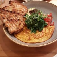 Tortilla de harina de garbanzos con pan tostado, verduras, aguacate y paté de aceitunas negras. at Source in York