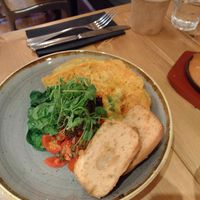 Chickpea omelet with GF sourdough toastm pea sprouts, spinch, olive tapenade, and cherry tomato salsa at Source in York