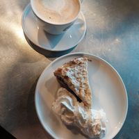 Vegan blueberry cake with vegan cream, cappuccino at Espresso House in Trondheim