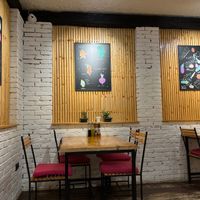 Interior dining area with decor at Crust n Crumb in Pristina