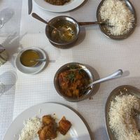 Chana Masala on top and Aloo Gobi on the bottom. Rice is an extra order and doesn’t come with the dish .  at Red Fort in Budens