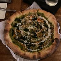 A dish titled "crust + vegan" kale pesto, carrot, caramelized onion, apple, walnut, vegan creme fraiche at Brazen Open Kitchen + Bar in Dubuque