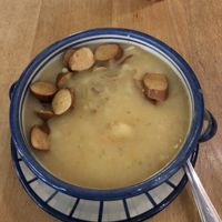 potato soup with tofu sausages  at Aha Cafe in Dresden