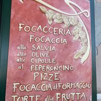 Poster with some of their focaccia options at Cose Buone in Camogli