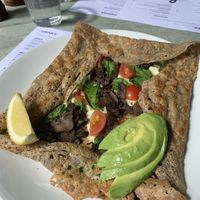 Spinach avo mushroom galette with vegan cheese and added cherry tomatoes. Bon appetite!  at Flo's Crêperie in Noosa Heads