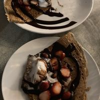 Crêpe - Chocolate sauce, banana, grilled almonds & Vanilla ice cream  ( divided in half)  at Flo's Crêperie in Noosa Heads