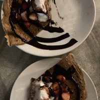 Crêpe - Chocolate sauce, banana, grilled almonds & Vegan ice cream 😍 (divided in half)   at Flo's Crêperie in Noosa Heads