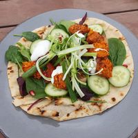 SWEET POTATO AND RED PEPPER FALAFEL FLATBREAD (v) (ve) Baby leaves, spring onion, tomato, cucumber, pomegranate seeds and a lemon mayonnaise at Morning Star in Swinton