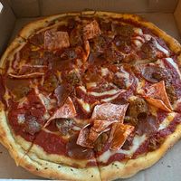 Large meat lover’s pizza at Meek's Vegan Pizza in Houston