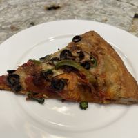 This piece was reheated in the air fryer the next day. It was even better!  at Meek's Vegan Pizza in Houston