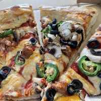 Pizza with beyond sausage, mushroom, and jalapeño.  at Meek's Vegan Pizza in Houston