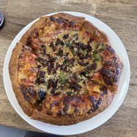 Personal pizza with red pepper, spinach, and jerk mushrooms  at Meek's Vegan Pizza in Houston