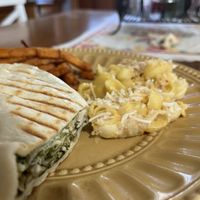 Vegan - chicken Caesar wrap with sweet potato fries along with mac n cheese. The portions are big too!     at Vegan Eats and Treats Cafe in Glen Rock